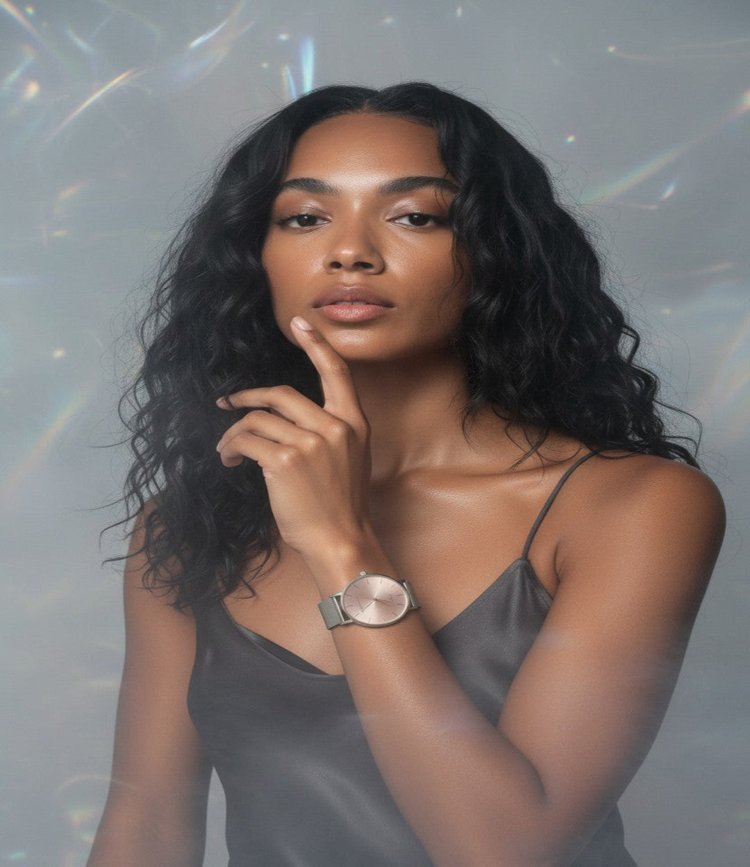 Woman wearing a gray slip dress with a advance blush quartz movement watch 36mm in blurred background
