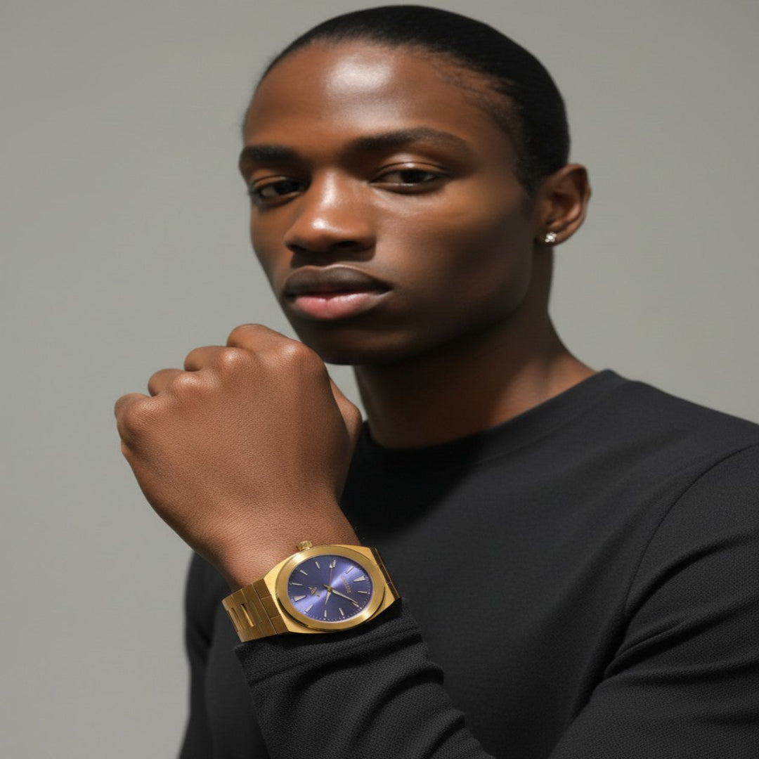 Man wearing elevate link peri swiss movement yellow gold /purple watch with a gray background