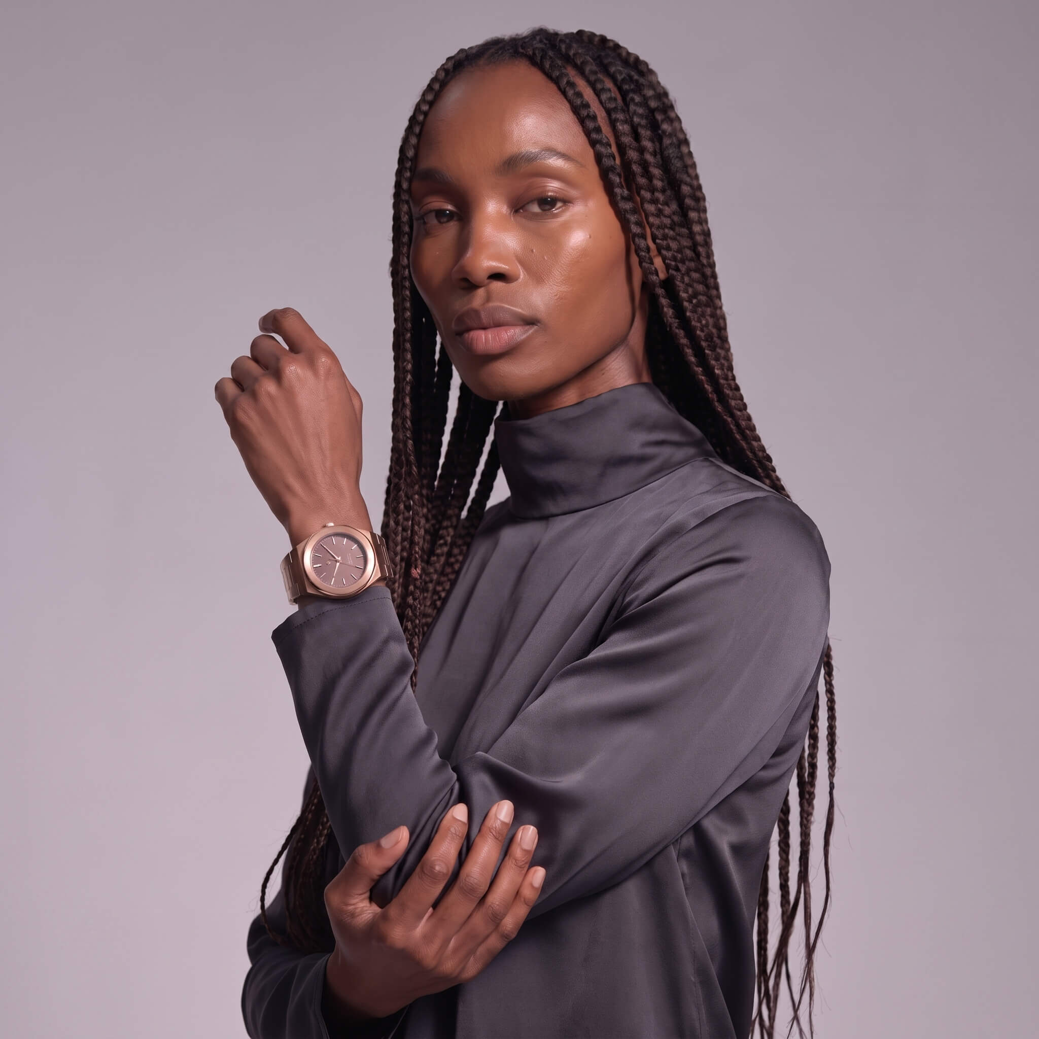 Elevate Link Mocha rose gold watch styled on wrist of black woman, front view