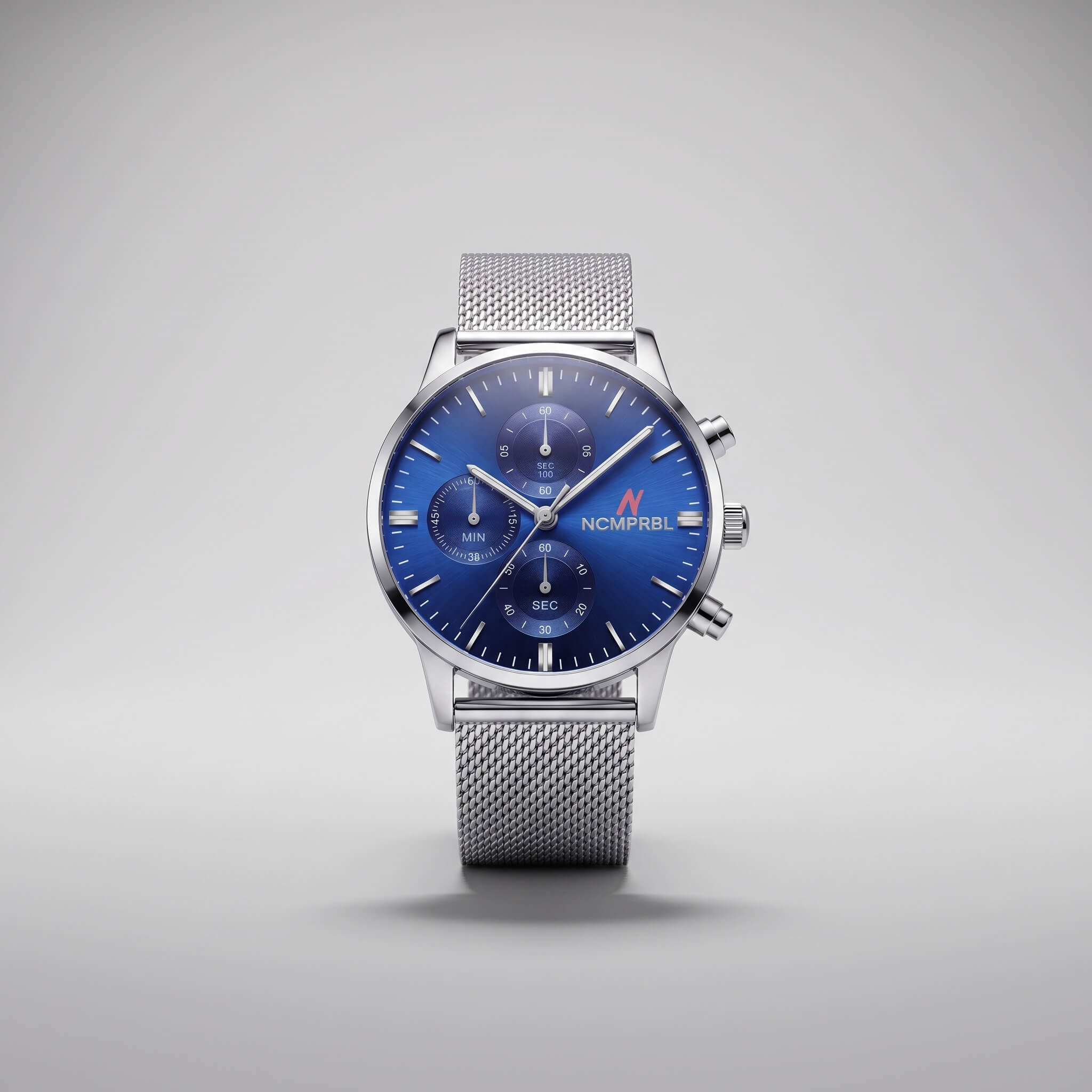 A silver stainless steel chronograph watch with a blue dial and a matching blue and silver mesh strap, shown against a neutral gray background.